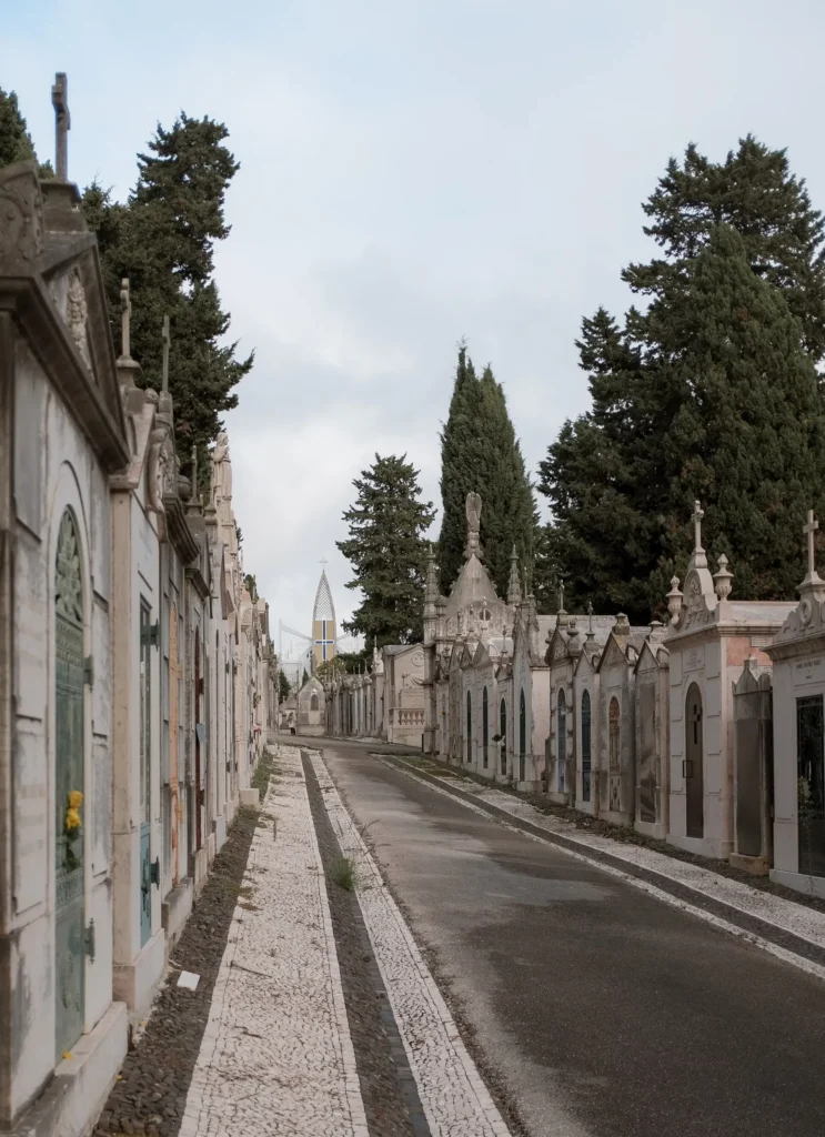 Road lined with mausoleums inside Prazeres Cemetery in Lisbon.
