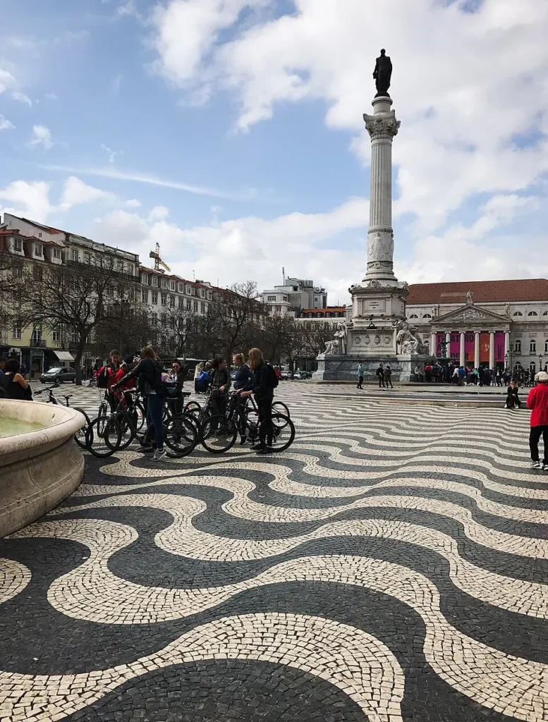 View of Rossio Square in Lisbon’s historic center, with the Pedro IV Monument and the square’s surrounding buildings.