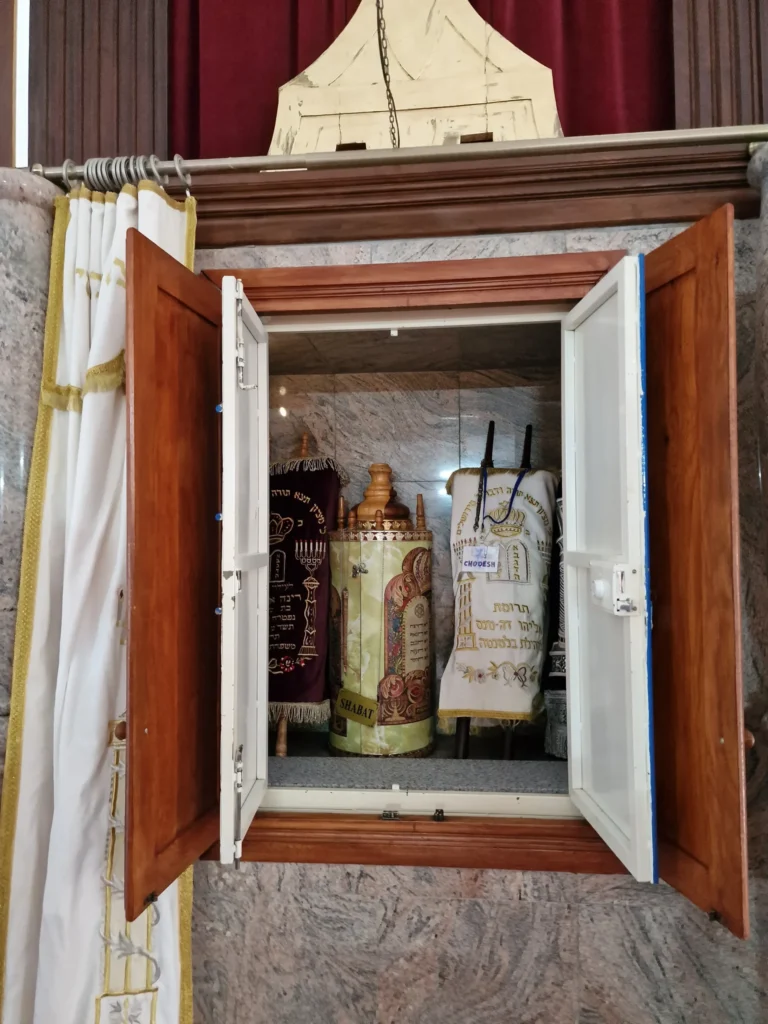 Four Torah scrolls inside the Aron Kodesh (Holy Ark)